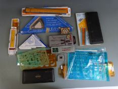 A quantity of draughtsman's drawing equipment including stencils, drawing sets, set squares and
