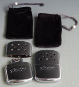 Two Zippo hand warmers in pouches