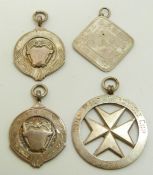 Four football or similar sporting medals comprising two with Chinese silver marks for Wing Nam,
