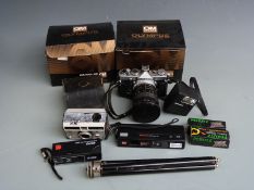 Olympus OM-1 SLR camera with Makinon 1:3.5-4.5 f=28-80mm zoom lens, various accessories and boxes