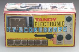 Tandy Electronic TV Scoreboard video games console with pistol controller, in original box.