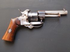 Belgian 7mm pinfire six-shot double action revolver with shaped wooden grips, folding trigger and