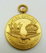 A 9ct gold Inter-service Association Football medal with eagle below two crowns, engraved Winners