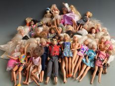 A large collection of mainly Barbie dolls together with various outfits.