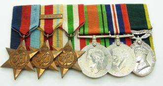 British Army WWII medals comprising 1939/1945 Star, Africa Star with clasp for 8th Army, Italy Star,