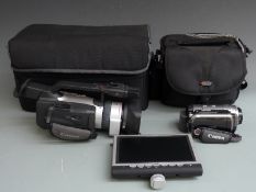 Two Canon digital video cameras comprising XM2 and a HG10E HDD example