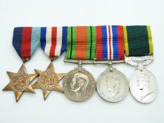 British Army WWII medals comprising 1939/1945 Star, France & Germany Star, Defence Medal, War