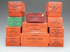 Eleven Hornby 0 gauge railway wagons, vans and accessories including four No. 50 goods vans, crane