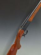 Baikal model IJ-18 12 bore single barrelled shotgun with engraved lock, chequered semi-pistol grip