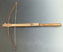 A vintage crossbow with wire string and semi pistol grip, NVSN