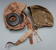 Two United States Army Air Force flying helmets, one with integral ear pieces