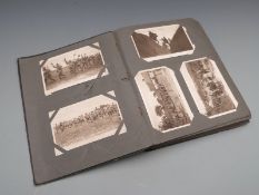 WWI postcard album containing approximately 100 mainly British Army Western Front cards, some in