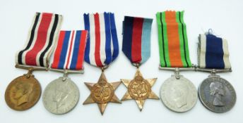 British Navy WWII medals comprising 1939/1945 Star, France & Germany Star, Defence Medal, War