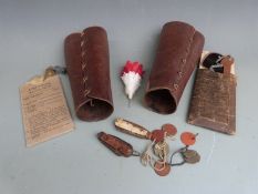 Pair of leather gaiters, two clasp knives, identity discs etc