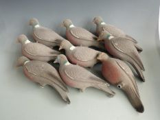 Nine felt covered plastic pigeon decoys