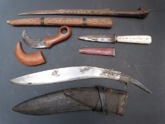 Four bladed weapons to include a 19thC short dagger with steel blade, ivory handle and red leather