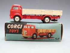 Corgi Toys diecast model Commer (5 Ton) Dropside Lorry with red cab and chassis and cream bed,