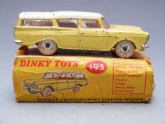 Dinky Toys diecast model Rambler Cross Country Station Wagon with yellow body, white roof and red