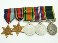 British Army WWII medals comprising 1939/1945 Star, Burma Star, Defence Medal, War Medal and
