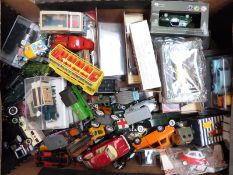 Fifty-nine various diecast and other model vehicles including Schuco clockwork tinplate car,