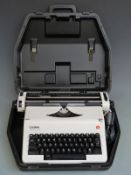 Olympia Monica Electric de Luxe typewriter in hard carry case