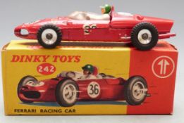 Dinky Toys Ferrari racing car with red body, white and green driver and racing number 36, 242, in