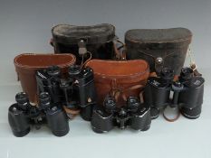 Four pairs of binoculars comprising Ross 9x35, Wray of London 8x40, Pentax Ashanti 10x50 and