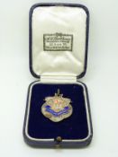 Hallmarked silver and enamel football medal with HMS Pembroke banner below crown and flag to