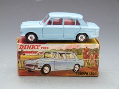 Dinky Toys diecast model Triumph 1300 with pale blue body and red interior, 162, in original box.