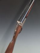 Gunmark Kestrel 12 bore side by side shotgun with named and engraved lock, engraved trigger guard,