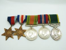 British Army WWII medals comprising 1939/1945 Star, France & Germany Star, Defence Medal, War