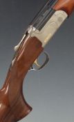 Classic Sporting 12 bore over and under shotgun with named locks, chequered semi-pistol grip and