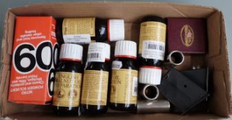 A collection of gun and shooting accessories including snapcaps, gun oil, etc