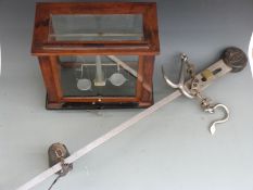 Avery steelyard and a cased set of laboratory scales