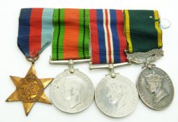 British Army WWII medals comprising 1939/1945 Star, Defence Medal, War Medal and Territorial