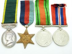 British Army WWII medals comprising 1939/1945 Star, Defence Medal, War Medal and Territorial