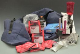 A collection of cartridge loading accessories including a Lee Perfect Powder Measure, Hornady .38 .