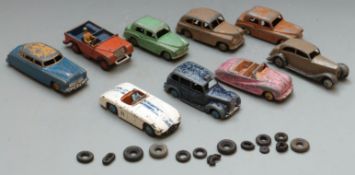 Nine Dinky Toys diecast model cars including Austin Taxi, Hillman Minx, Hudson Sedan, Austin