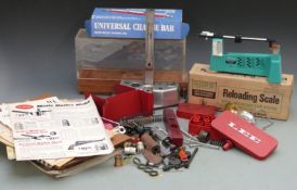 A collection of shotgun cartridge loading accessories including Lee reloading scale in original box