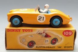 Dinky Toys diecast model Austin-Healey '100' Sports with yellow body, blue interior and hubs,