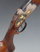 Arizaga 12 bore over and under sidelock shotgun with gilt engraved scenes of dogs and birds to the