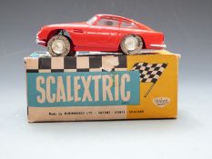 Tri-ang Scalextric model motor racing Aston Martin DB4 (G.T.) with red body, brown interior and