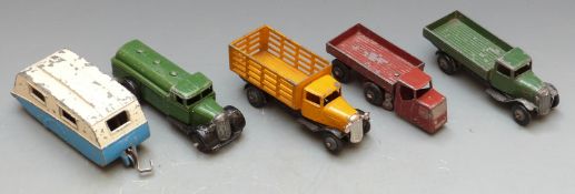 Five Dinky Toys diecast model vehicles including Petrol Tanker 25D, Market Gardeners Lorry 25F etc.