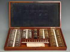 Cased set of optician's trial lenses, width of case 50cm