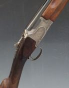 Winchester 12 bore over and under shotgun with engraved scenes of birds to the locks, engraved