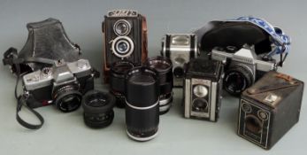 Quantity of cameras to include Minolta srT100x SLR with Rokkor 45mm 1:2 lens, Praktica MTL5B with