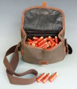 One-hundred-and-twelve Lyalvale English Sporter 12 bore shotgun cartridges, in canvas and leather