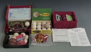 A collection of vintage golf balls including gutta percha exammple and Smakbak 'Captive Golf' set