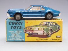 Corgi Toys diecast model Oldsmobile Tornado with blue body, spoked hubs and cream interior, 264,