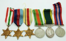British Army WWII medals comprising 1939/1945 Star, Africa Star, Italy Star, Defence Medal, War